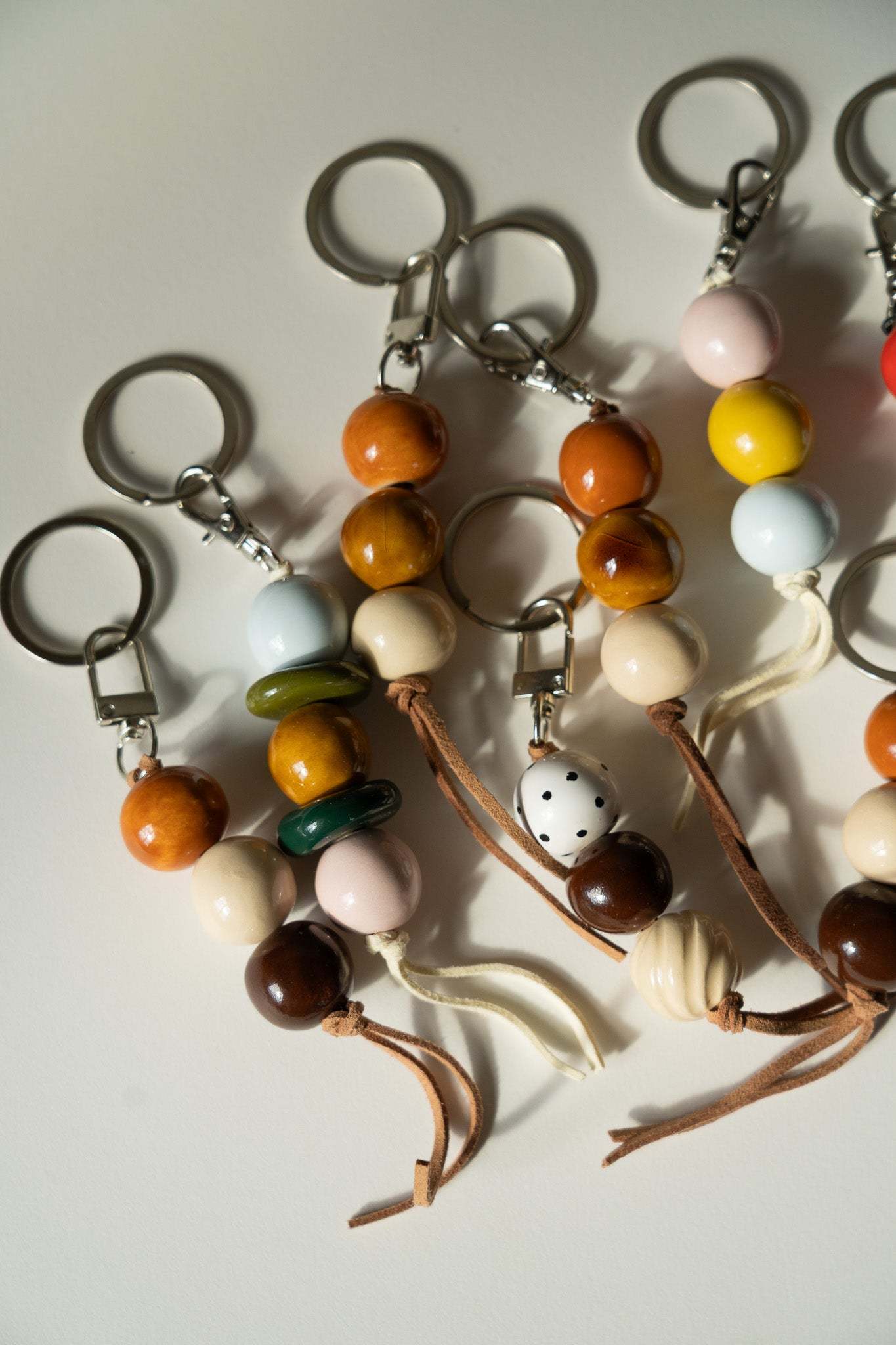 Handmade Ceramic Beaded Keychain in Brown and Green Tones