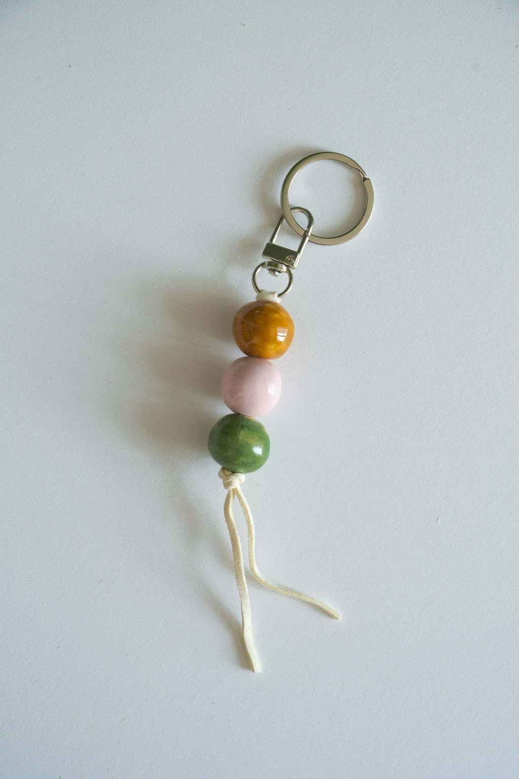 Handmade Ceramic Keychain in Warm Contrast Tones