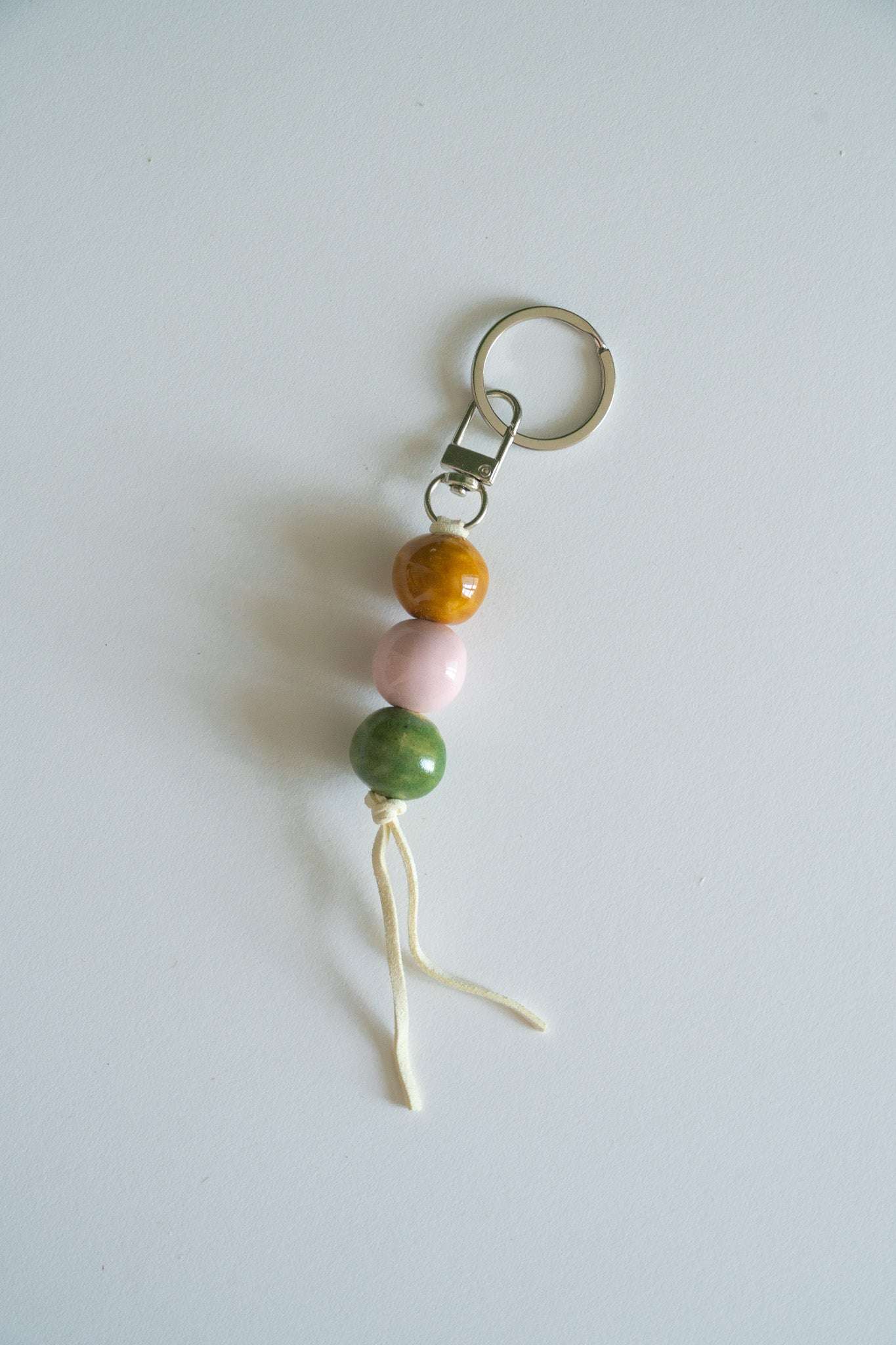 Handmade Ceramic Keychain in Warm Contrast Tones