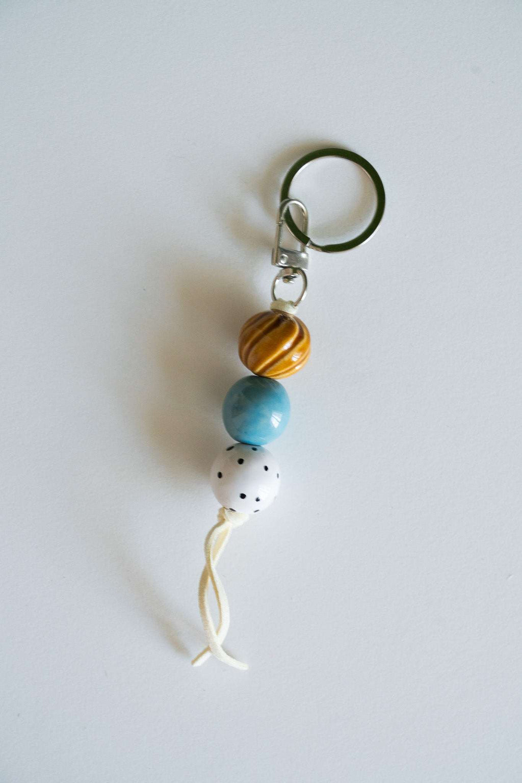 Handmade Ceramic Keychain with Warm Contrast Tones