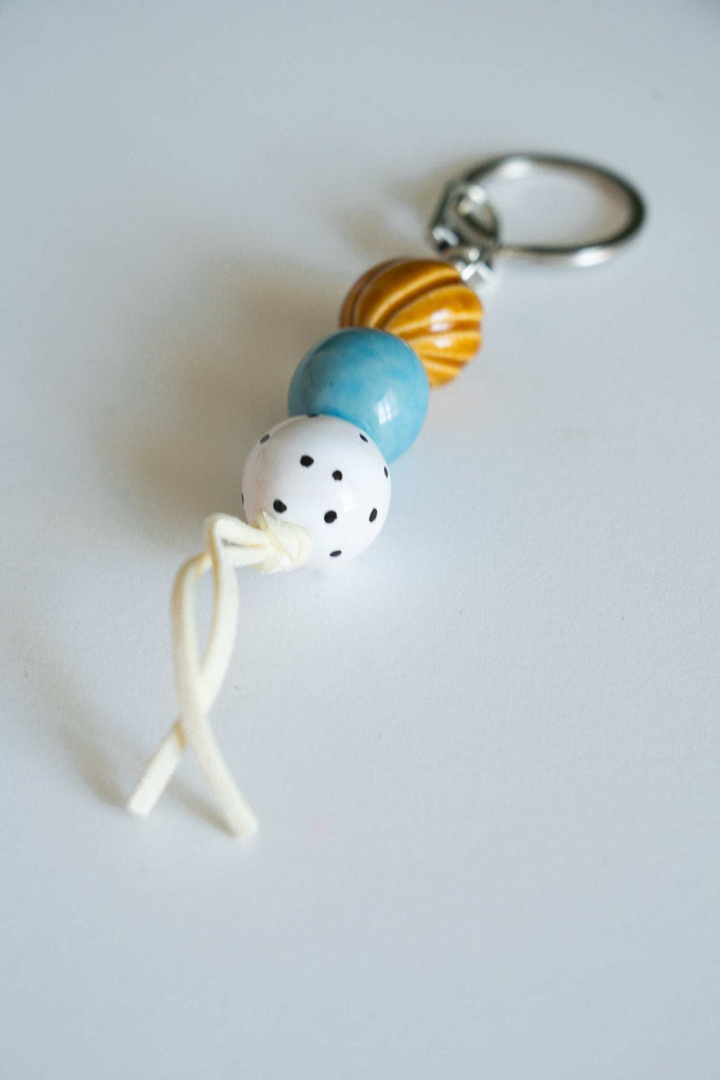 Handmade Ceramic Keychain with Warm Contrast Tones