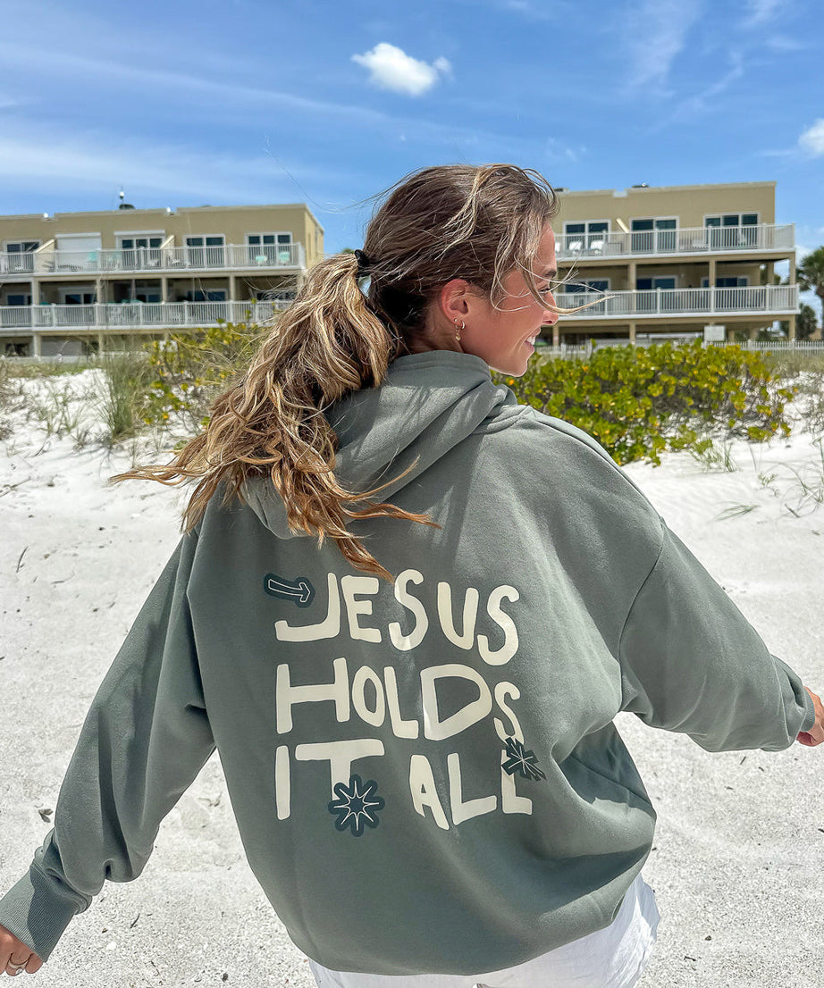Jesus Holds It All Unisex Hoodie