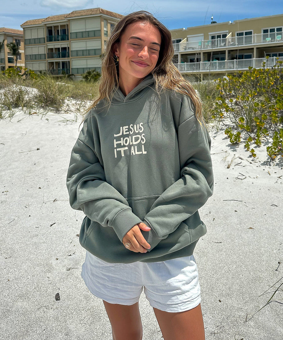 Jesus Holds It All Unisex Hoodie