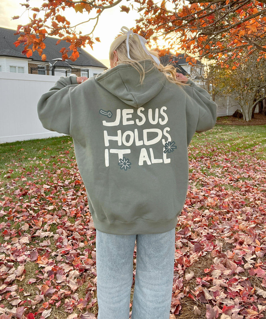 Jesus Holds It All Unisex Hoodie