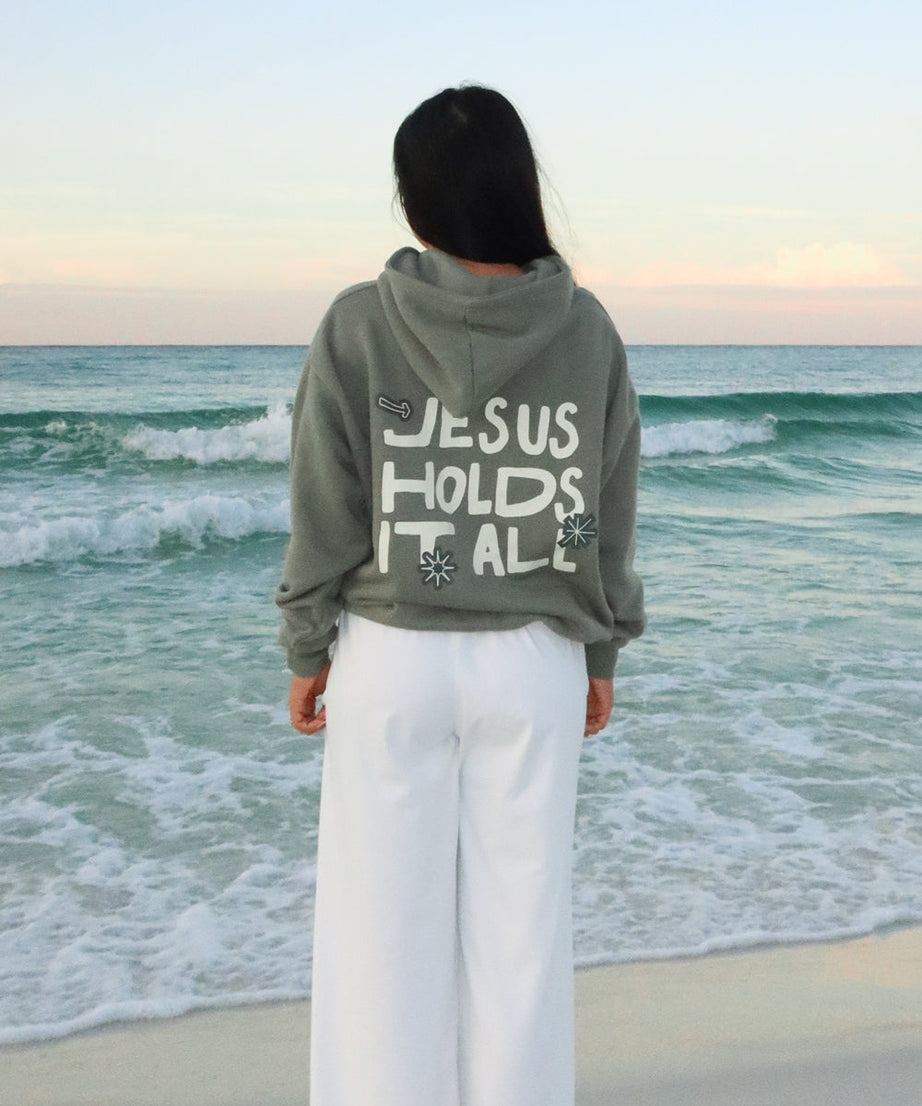 Jesus Holds It All Unisex Hoodie