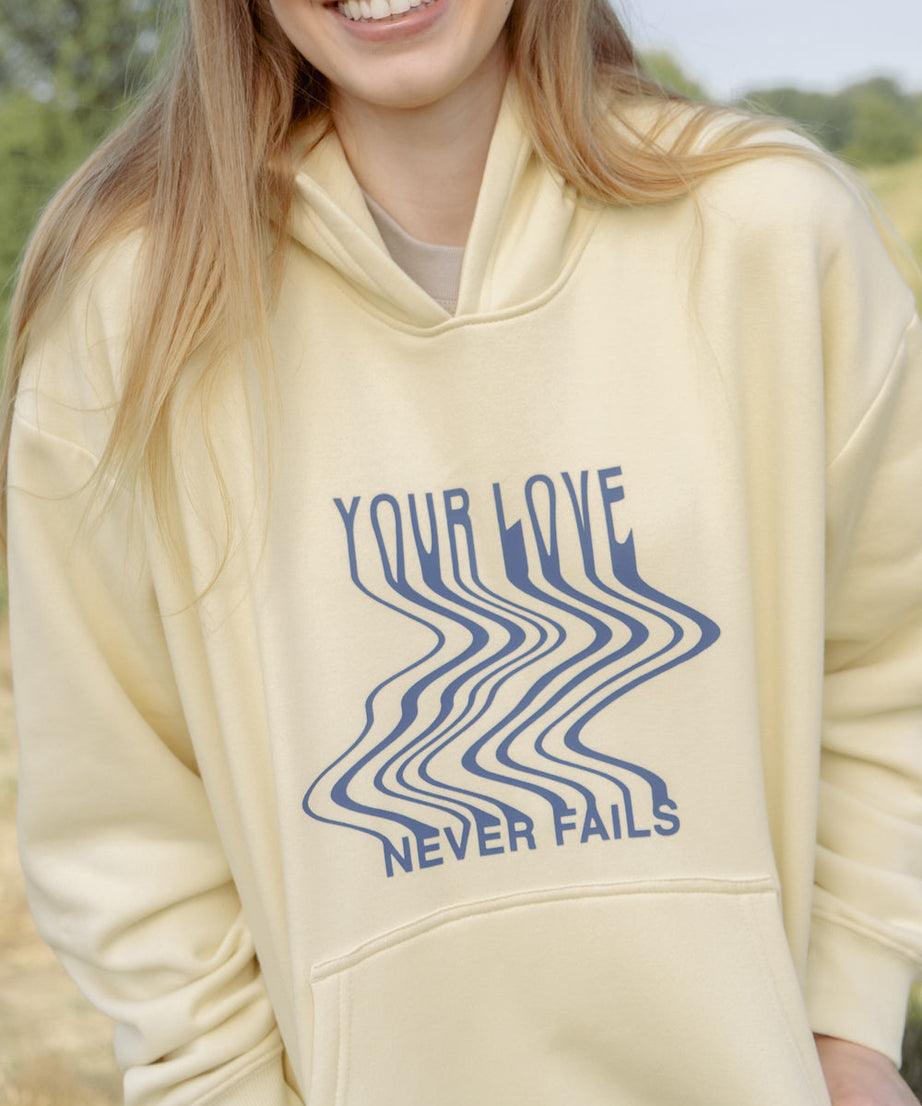 Love Never Fails Cream Unisex Hoodie