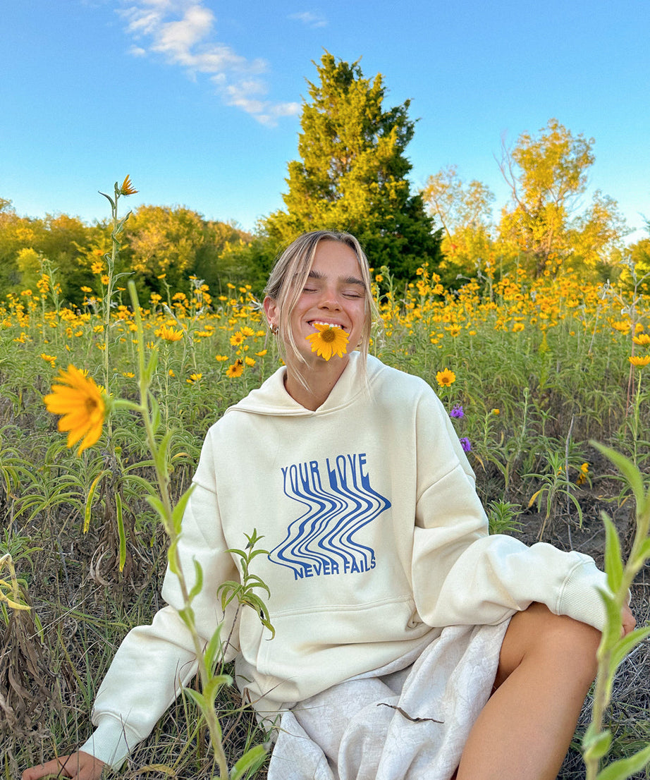 Love Never Fails Cream Unisex Hoodie