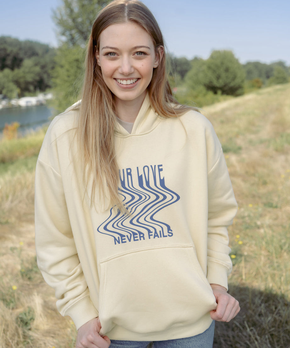 Love Never Fails Cream Unisex Hoodie