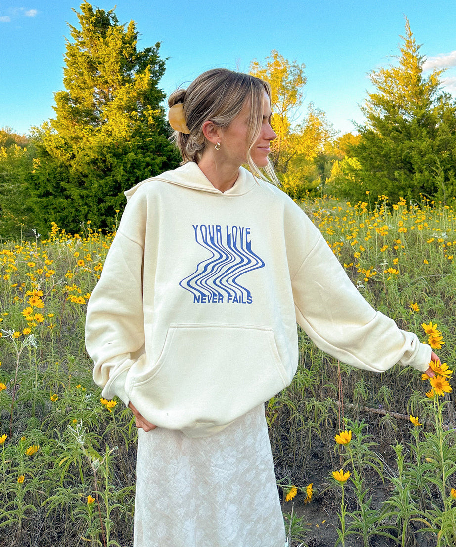Love Never Fails Cream Unisex Hoodie