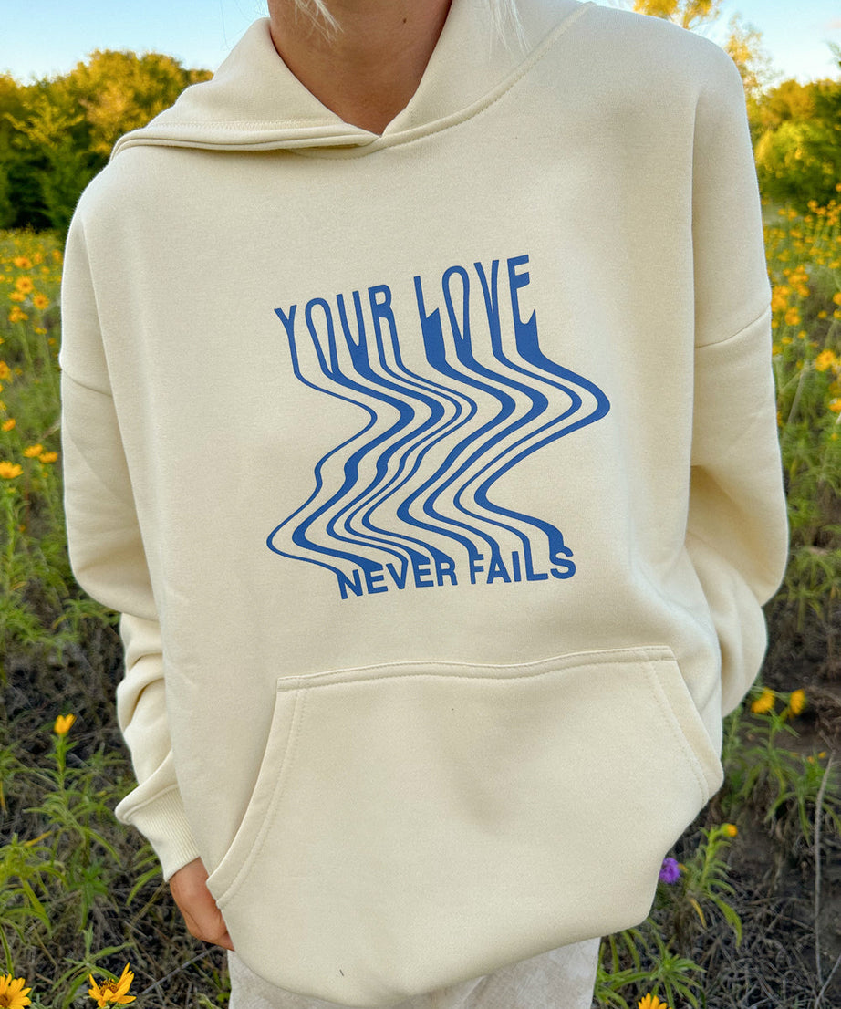 Love Never Fails Cream Unisex Hoodie