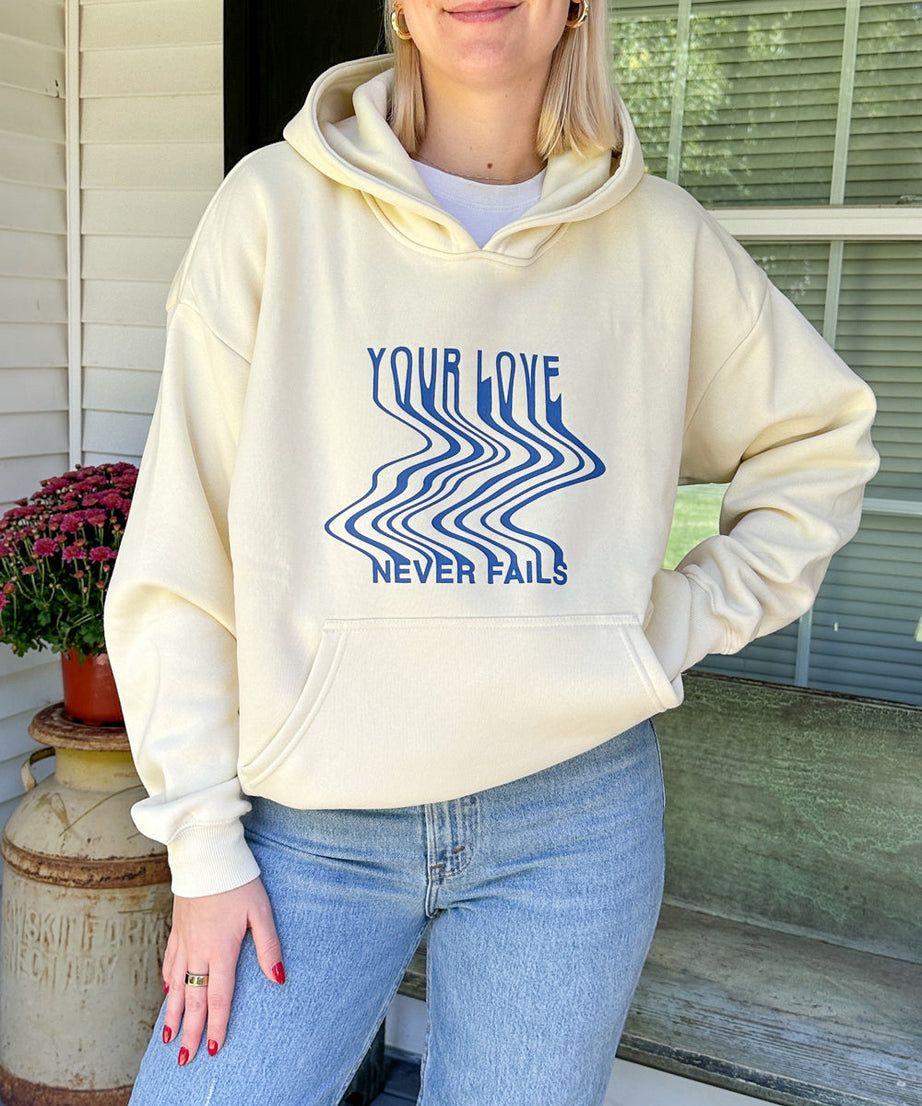 Love Never Fails Cream Unisex Hoodie