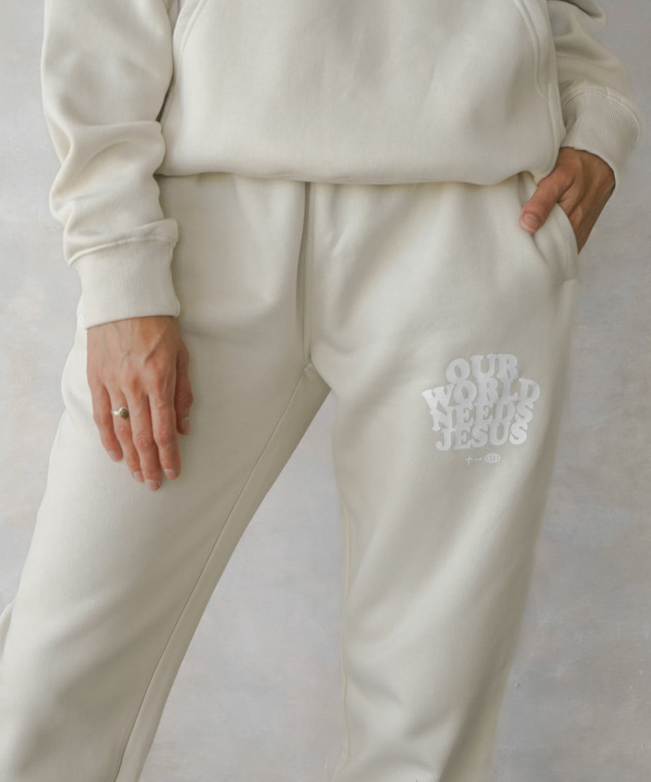 Our World Needs Jesus Beige Unisex Sweatpant