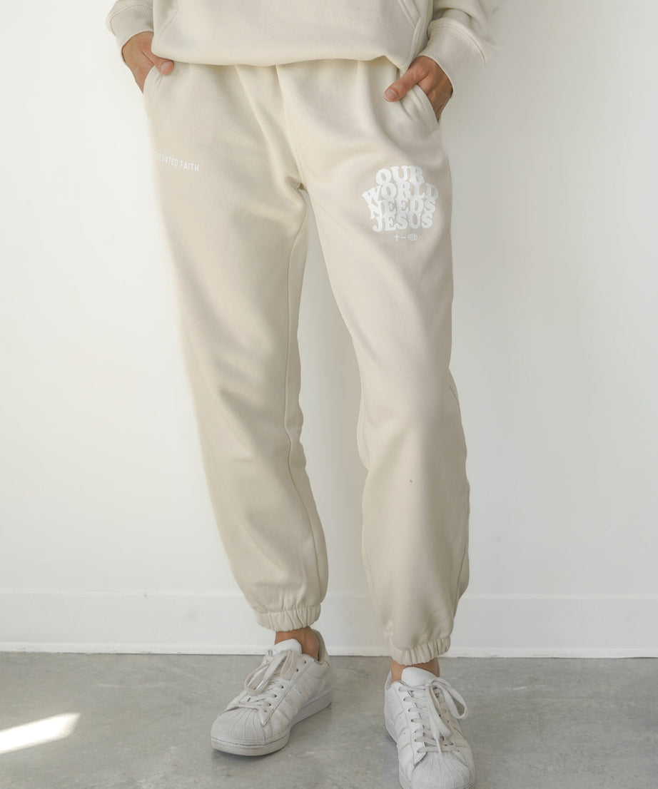 Our World Needs Jesus Beige Unisex Sweatpant